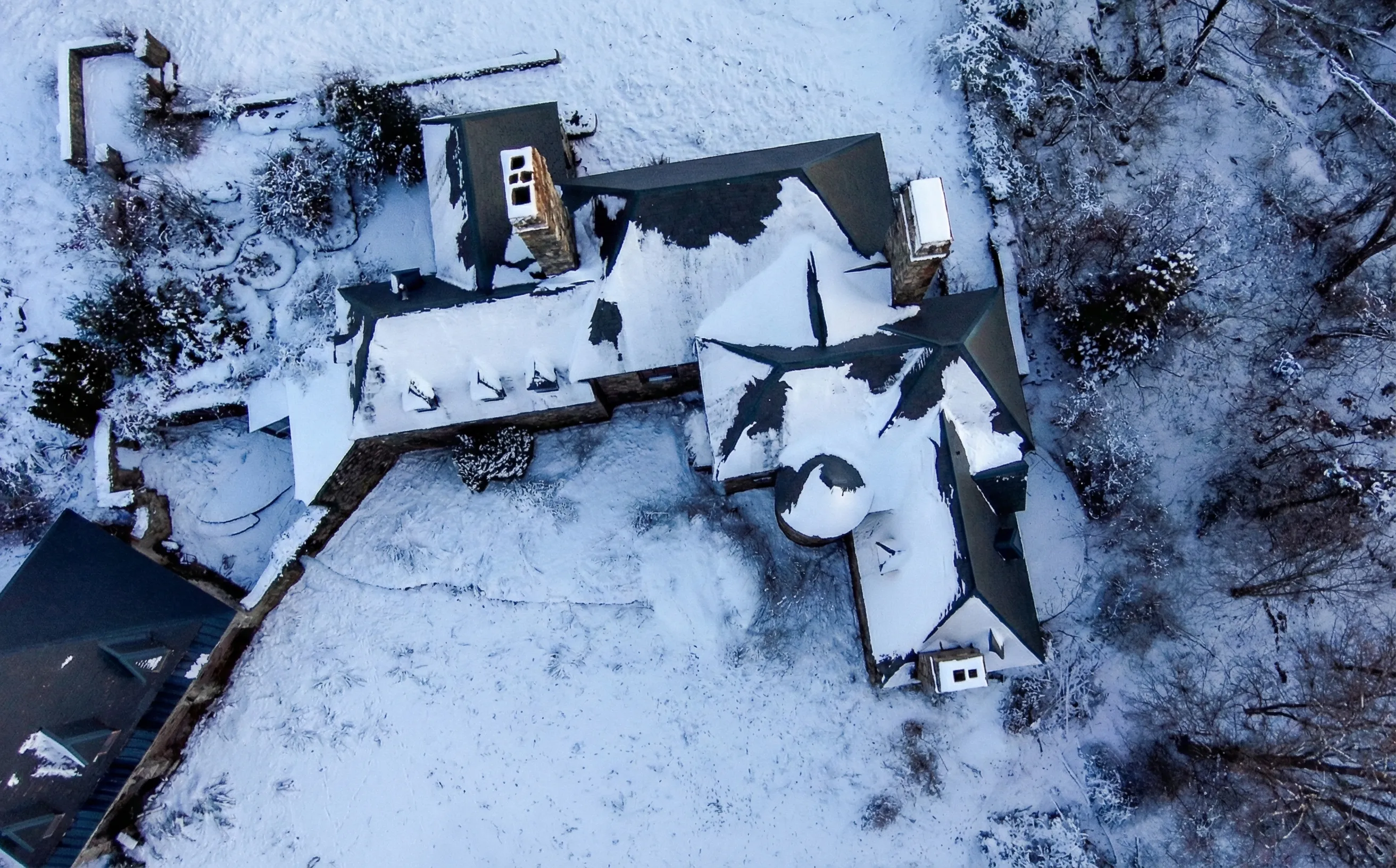 The castle grounds — mature trees and stone walls frame the estate